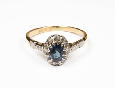 Lot 379 - A sapphire and diamond cluster ring