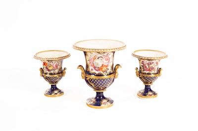 Lot 143 - A garniture of three English porcelain urns