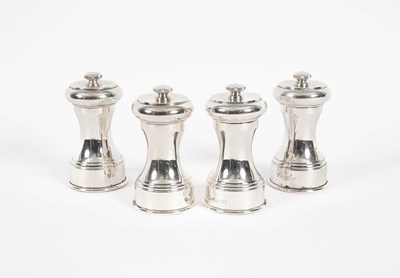 Lot 11 - A set of four silver pepper mills