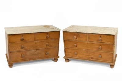 Lot 653 - A pair of Victorian pine marble top chests