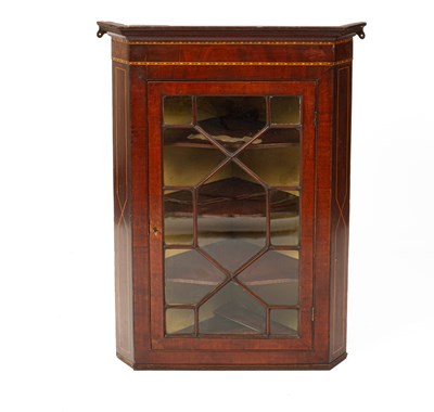 Lot 684 - A late George III mahogany hanging corner cabinet