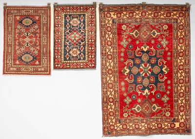 Lot 638 - A Kazak design rug and two others