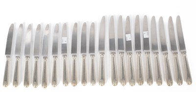 Lot 434 - A set of ten silver handled table knives