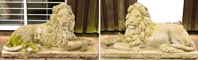 Lot 551 - A pair of stone recumbent lions