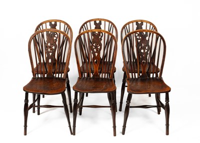 Lot 586 - A set of six Windsor wheel back dining chairs