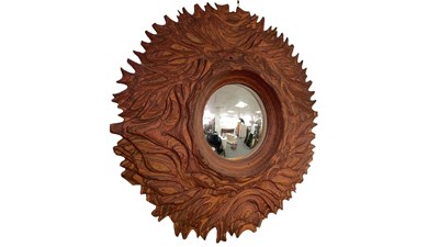 Lot 25 - A laminated wood and stained convex mirror