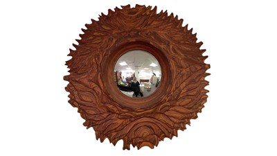 Lot 25 - A laminated wood and stained convex mirror