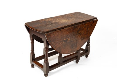Lot 575 - An 18th Century oak gateleg table