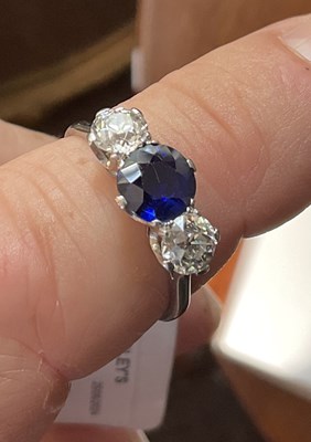 Lot 298 - A sapphire and diamond three-stone ring