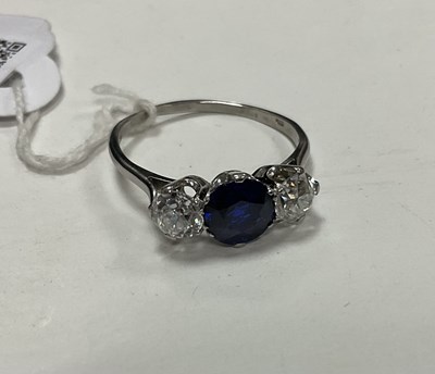 Lot 298 - A sapphire and diamond three-stone ring