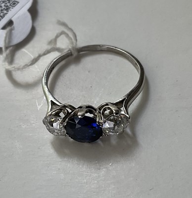 Lot 298 - A sapphire and diamond three-stone ring