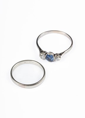 Lot 301 - An 18ct white gold sapphire and diamond three-stone ring