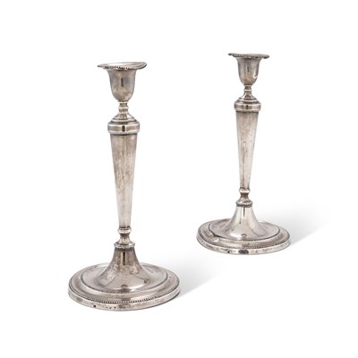 Lot 388 - A pair of George III silver candlesticks