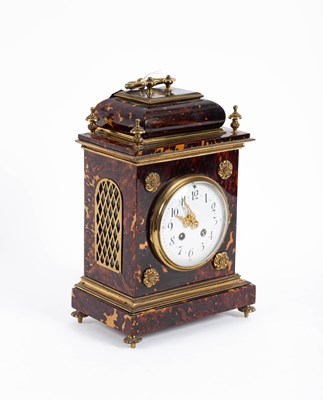 Lot 701 - A French tortoiseshell and gilt mounted mantel clock