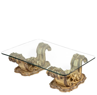 Lot 587 - A Baroque inspired glass top coffee table