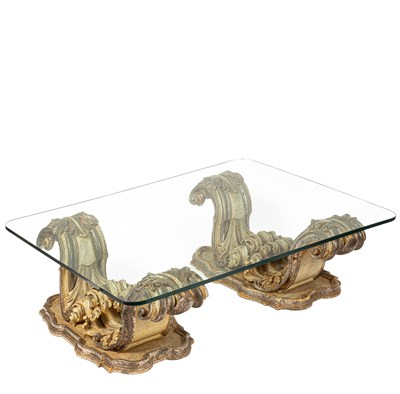 Lot 588 - A Baroque inspired glass top coffee table