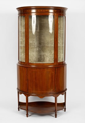 Lot 557 - An Edwardian mahogany and inlaid half round display cabinet