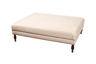 Lot 28 - A large cream upholstered footstool