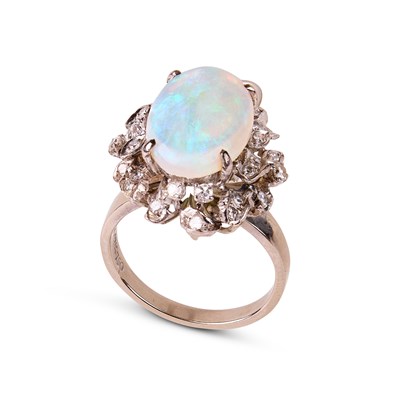 Lot 313 - An 18k white gold opal and diamond oval cluster ring