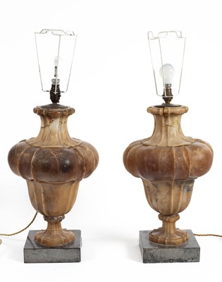 Lot 543 - A pair of lobed alabaster lamps