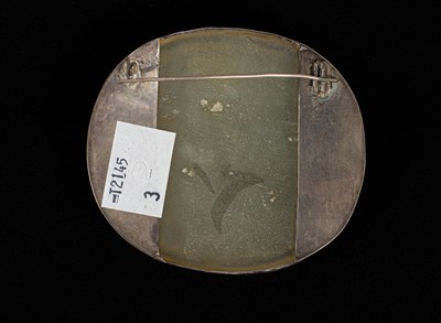 Lot 593 - A carved oval jade plaque
