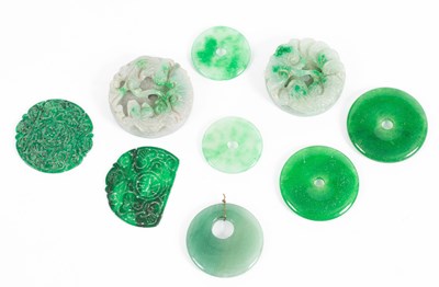 Lot 597 - Two carved jade roundels