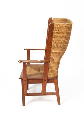 Lot 480 - An Orkney Highland oak and woven rush back arm chair