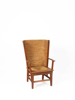 Lot 480 - An Orkney Highland oak and woven rush back arm chair