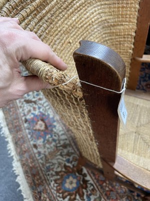 Lot 480 - An Orkney Highland oak and woven rush back arm chair