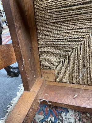 Lot 480 - An Orkney Highland oak and woven rush back arm chair