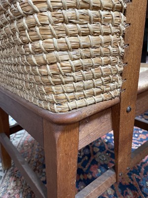 Lot 480 - An Orkney Highland oak and woven rush back arm chair