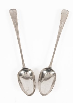 Lot 411 - A pair of George III feather edge silver serving spoons