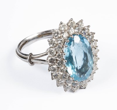 Lot 201 - A blue topaz and diamond cluster ring