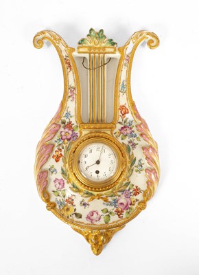 Lot 697 - A French porcelain clock in the form of a lyre