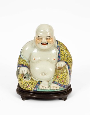 Lot 604 - A Chinese porcelain figure of Hotei