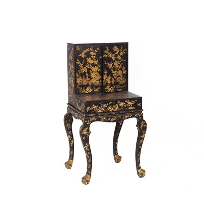 Lot 51 - A black lacquer and Chinoiserie and gold decorated cabinet on stand