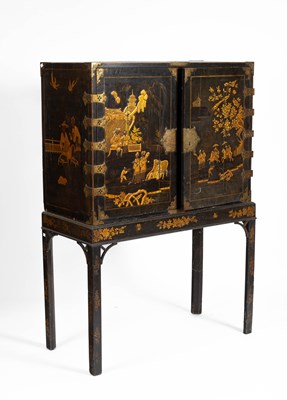 Lot 53 - A black lacquer and Chinoiserie decorated cabinet on stand