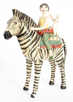 Lot 65 - A Marie Prett ceramic sculpture, girl on zebra