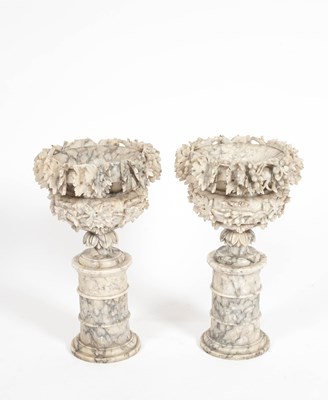 Lot 74 - A pair of alabaster urns on pedestal bases