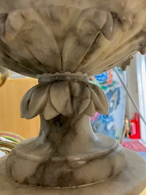 Lot 74 - A pair of alabaster urns on pedestal bases