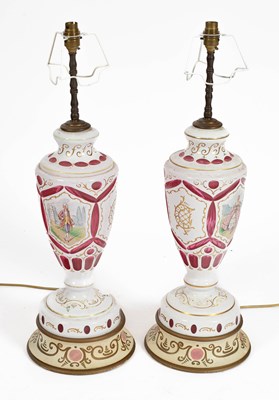 Lot 86 - A pair of white overlay cranberry flask Bohemian vases as lamps