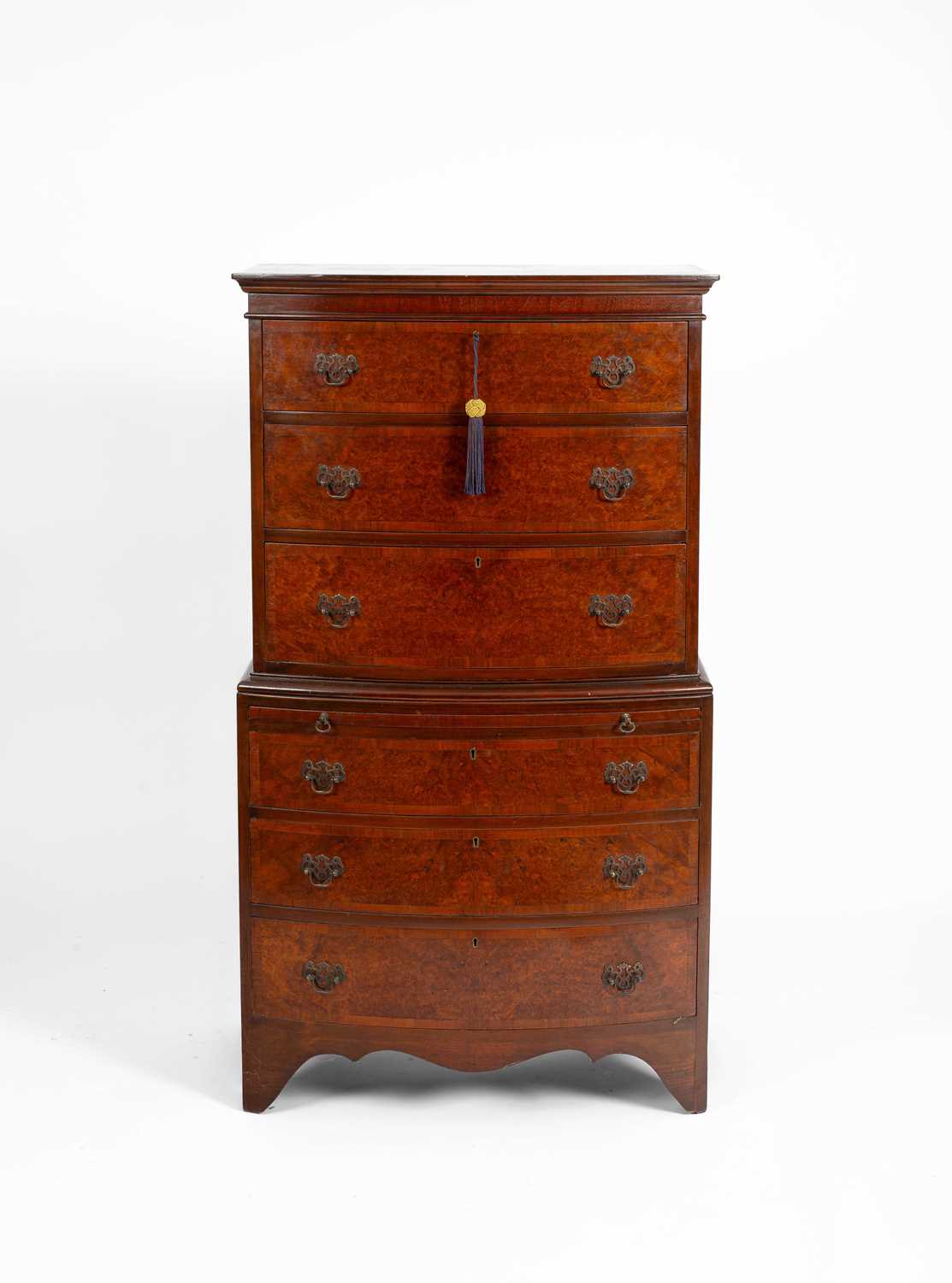 Lot 97 - A reproduction walnut and mahogany chest on chest
