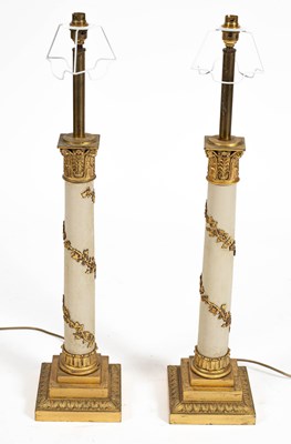 Lot 143 - A pair of gilt-brass and white painted Corinthian column table lamps