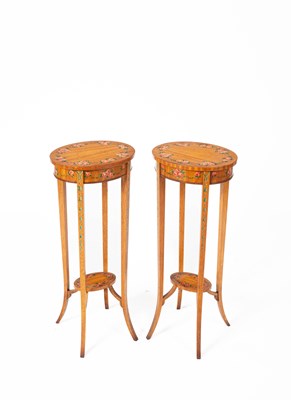 Lot 150 - A pair of George III style satinwood and floral painted jardinière stands