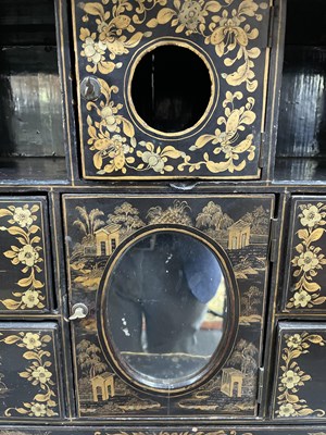 Lot 169 - A Chinese export black lacquered cabinet on stand