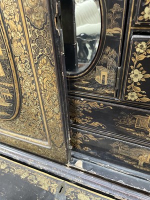 Lot 169 - A Chinese export black lacquered cabinet on stand