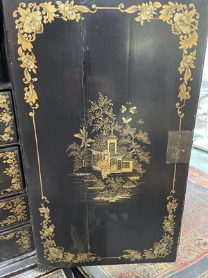 Lot 169 - A Chinese export black lacquered cabinet on stand