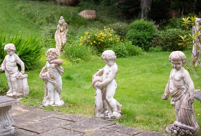 Lot 16 - A set of four reconstituted stone figures
