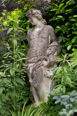 Lot 22 - A reconstituted stone figure of Bacchus