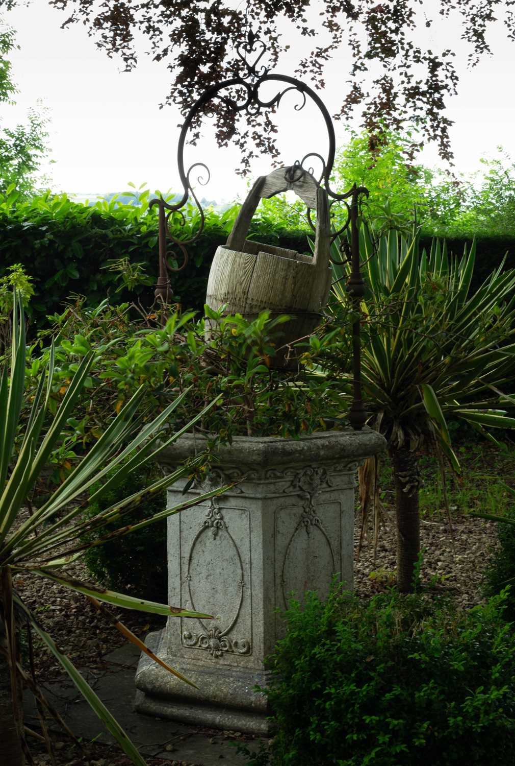 Lot 26 - A hexagonal reconstituted stone wellhead